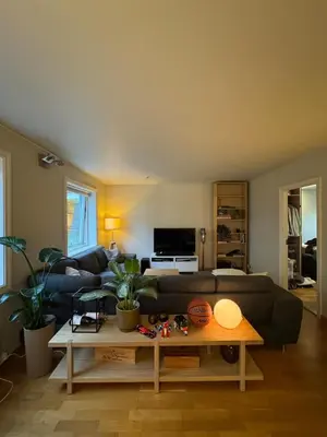 a living room with a couch and a coffee table at Gimleveien 36G in Bergen