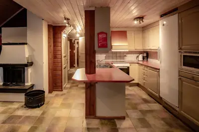 a kitchen with a island in the middle of it at Bakkebyvegen 7B in Trysil
