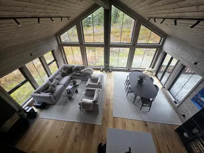 an overhead view of a living room with a table and chairs at Unique hytta with jacuzzi, sauna, 7 bedrooms in Trysil