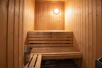 a sauna with a bench in a wooden room at Bakkebyvegen 13A in Trysil