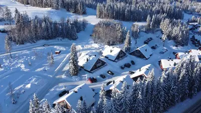 an aerial view of a village covered in snow at Bakkebyvegen 13B in Trysil