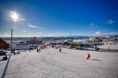 a group of people skiing on a ski slope at Timber Cabin With Mountain View in Beitostøl