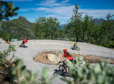 a group of people riding bikes on a road at Large Ski in-Ski out Apartment for Groups in Hemsedal