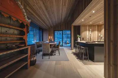 a kitchen and dining room with a table and chairs at Nyørk Chalet, Hemsedal in Hemsedal