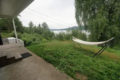 a hammock sitting on the side of a yard at Fjordview retreat in Hamre