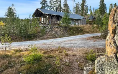 a house on top of a hill with a road at Nice Home In Tinn Austbygd With Sauna in Luråsgrendi