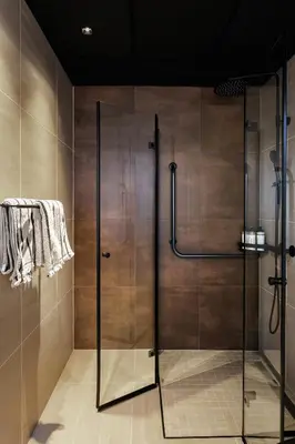 a shower with a glass door in a bathroom at Rosenlund Hamn in Sande