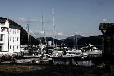 a group of boats are docked in a harbor at Rosenlund Hamn in Sande