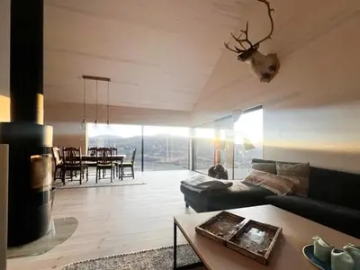 a living room with a couch and a table at New Cabin With Panoramic Views At Hardangervidda in Eidfjord