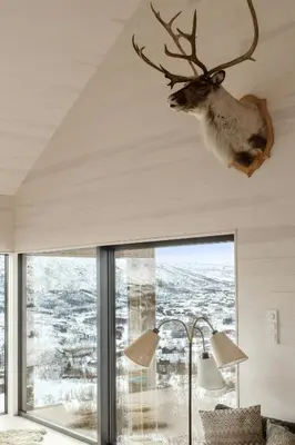 a deer head hanging from the ceiling of a house at New Cabin With Panoramic Views At Hardangervidda in Eidfjord