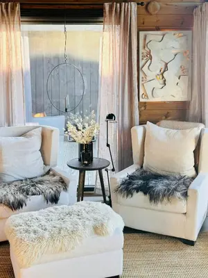 a living room with two chairs and a table at Apartment With Panoramic Views In Beitostølen in Beitostøl