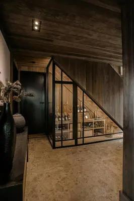 a room with a display case with glasses in it at Modern Mountain Cabin With Views In Hovden in Hovden