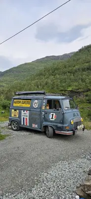 a van parked on the side of a gravel road at Retro & Vintage Camping in Vaksdal