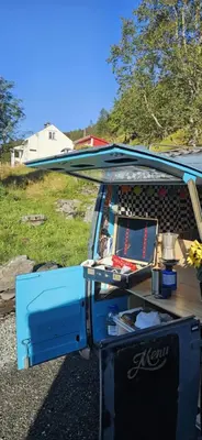 an open refrigerator with a surfboard on top of it at Retro & Vintage Camping in Vaksdal