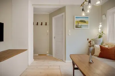 a living room with a couch and a table at THIS IS BERGEN, 2 min walk to everything in Bergen