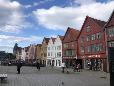 a group of buildings on a street with people walking at THIS IS BERGEN, 2 min walk to everything in Bergen