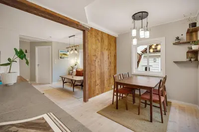 a dining room with a wooden table and chairs at THIS IS BERGEN, 2 min walk to everything in Bergen