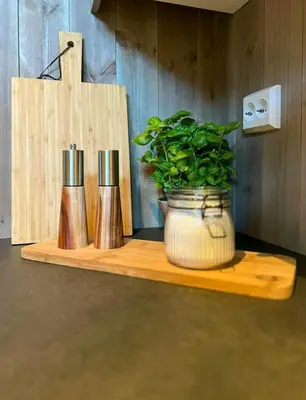 a wooden shelf with a potted plant on it at Modern Apartment In The Heart Of Hovden in Hovden