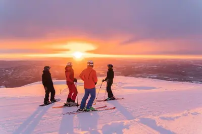a group of people standing on top of a snow covered mountain at Nice cabin at Norefjell skicenter in Noresund