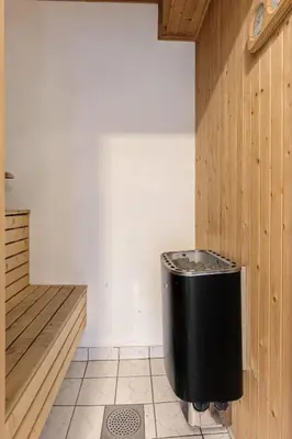 a bathroom with a black trash can in a room at Trysilfjell 752E by Vacation Trysil in Trysil