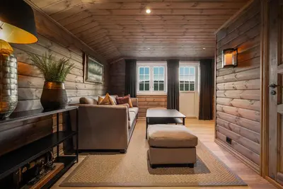 a living room with a couch and a chair at The Nordic Retreat - Stryn in Stryn