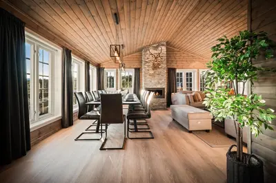 a living room with a table and chairs and a couch at The Nordic Retreat - Stryn in Stryn