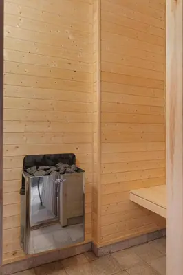 a sauna with a trash can in the corner at Mosetra2038 by Vacationtrysil in Trysil