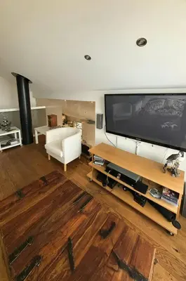 a living room with a large flat screen tv at Modern Cabin With Panoramic Views In Aukland in Jelsa