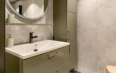 a bathroom with a sink and a mirror at Beautiful Home In Bjorli in Bjorli