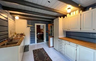 a kitchen with white cabinets and a sink at 3 Bedroom Cozy Home In Mesnali in Mesnali