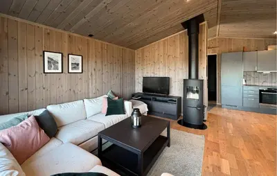 a living room with a couch and a stove at Stunning Home In Gålå With Wifi in Gålå