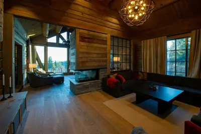 a living room with a couch and a fireplace at Handcrafted Log Cabin At Golsfjellet in Gol