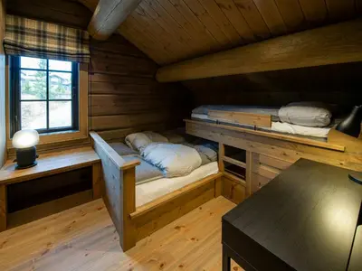 a small cabin with a bunk bed in it at Handcrafted Log Cabin At Golsfjellet in Gol