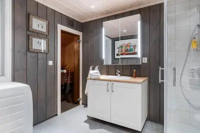 a bathroom with a sink and a mirror at Fagerasen 303 by Vacation Trysil in Trysil