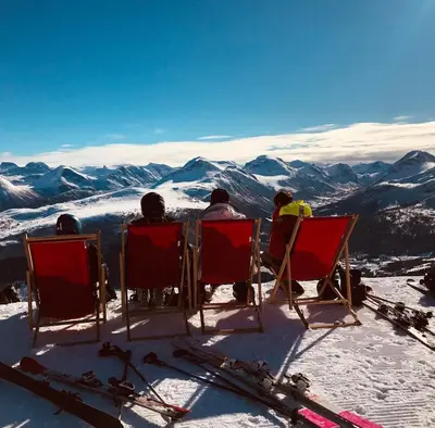 a group of people sitting in chairs on top of a mountain at Nikolaisens Nordic Panorama hideaway in Stranda
