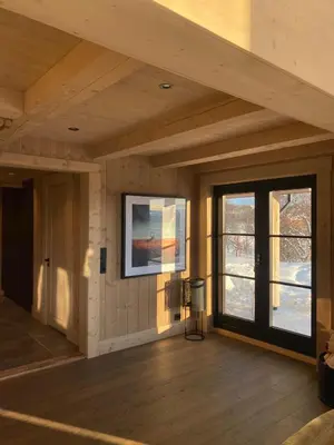 a room with a painting on the wall and windows at Exclusive cottage on Geilo in Hol