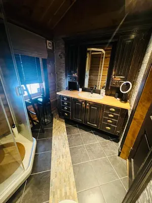 a bathroom with a sink and a mirror at Cabin in Kvamskogen in Kvam