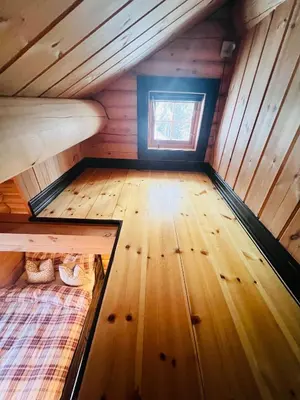 a small room with two bunk beds in a tiny house at Cabin in Kvamskogen in Kvam