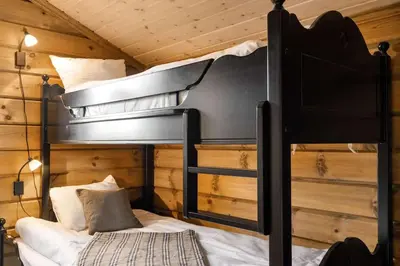 a bedroom with two bunk beds in a cabin at Trysilfjell hytteområde 922 by Vacation Trysil in Trysil