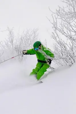 a person is skiing down a snow covered slope at Skarslia Apartment in Skarsgård