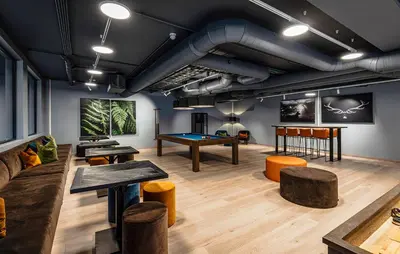 a living room with tables and a pool table at Cozy Apartment In Hemsedal With Sauna in Hemsedal