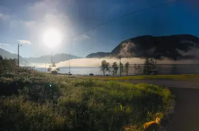 a view of a body of water with a mountain at JOlster apartaments - lake view in Årdal