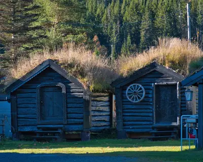 an old log cabin with a grass roof at Ringen Camping in Vestre Gausdal