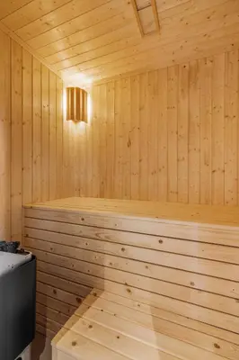 a wooden sauna with a wood paneled wall at Sentralt plassert hytte, alt i gangavstand in Flå
