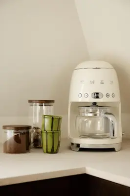a white toaster sitting on a kitchen counter at Bryggen Boutique l Stay Uniquely l 2 min to Floyen in Bergen