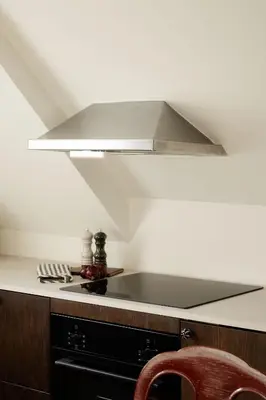 a kitchen with a hood over a stove at Bryggen Boutique l Stay Uniquely l 2 min to Floyen in Bergen