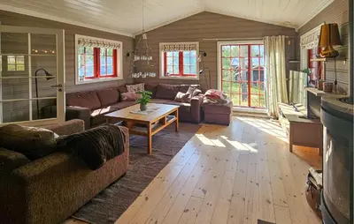 a living room with a couch and a table at Gorgeous Home In Eggedal With Sauna in Eggedal