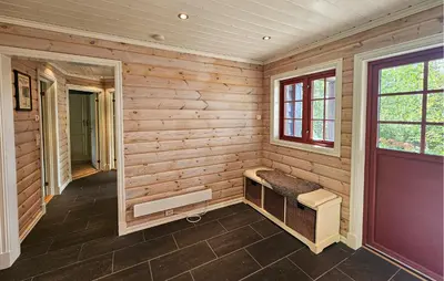 a room with a bench in a wooden wall at Gorgeous Home In Eggedal With Sauna in Eggedal