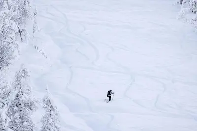 a person is skiing down a snow covered slope at Brand new luxury apartment by the slopes, Hemsedal in Hemsedal