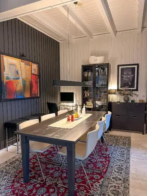a dining room with a table and chairs at Modern and spacious home in Trondheim